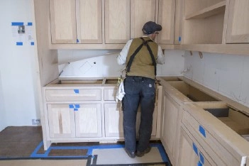 About People Helping People kitchen cabinet installation work