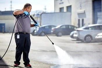 About People Helping People pressure washing parking lot surface