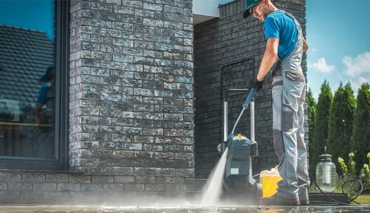 About People Helping People pressure washing home exterior walkway